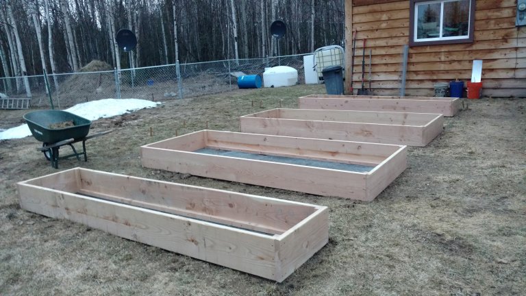 Four of our six garden beds installed and leveled